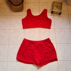 Red sports bra and athletic shorts